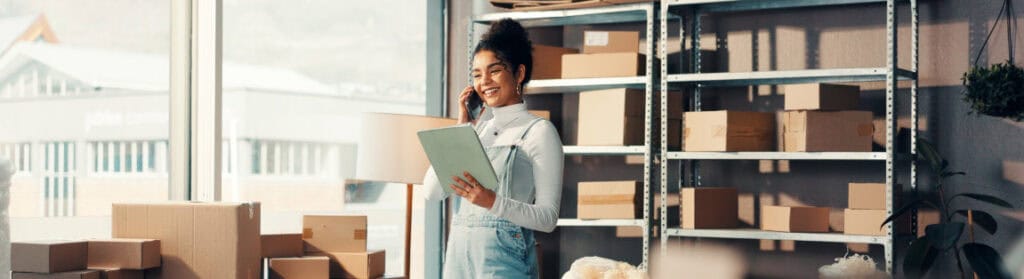 A smiling business owner happy with the success Digital First's virtual page strategies is delivering.